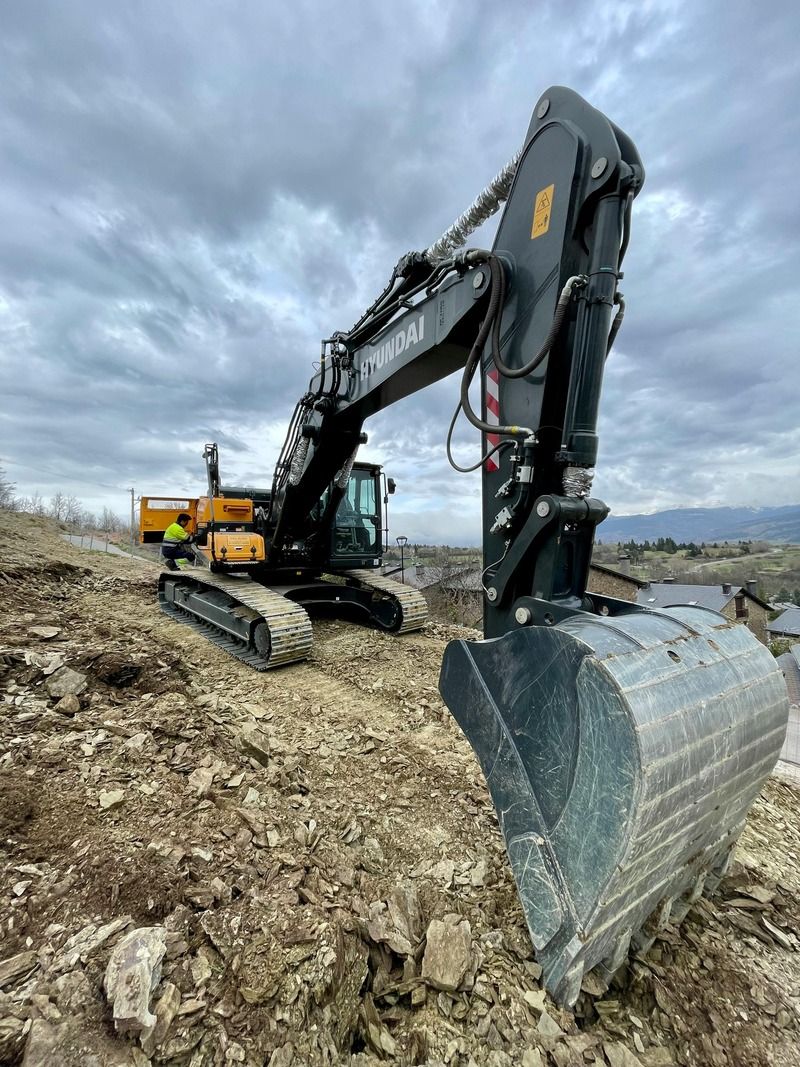 Excavator with bucket on a site